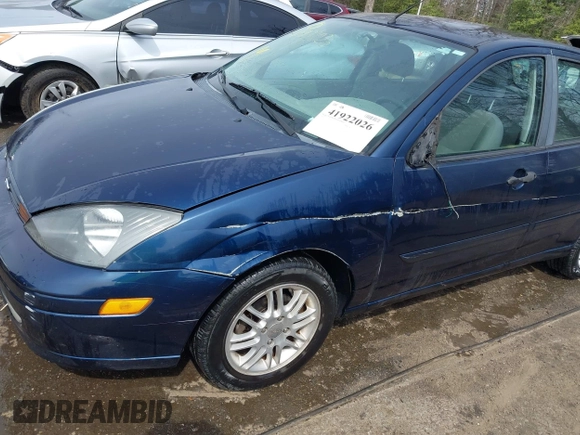 2004 Ford Focus ZX5 z VIN 3FAFP37334R120359, wystawiony jako IAAI lot #41922026 z przebiegiem 115 789 mil mil oraz . Historia ofert i sprzedaży dostępna na DreamBid. Obrazek 6.