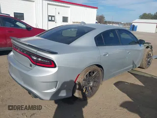 2019 Dodge Charger Scat Pack with VIN 2C3CDXGJXKH599632, listed as a IAAI auction lot 41666680 with 116,995 mi miles and . Bid and sale history available at DreamBid. Image 4.