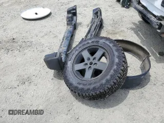 2013 Jeep Wrangler Unlimited Sport with VIN 1C4BJWDG8DL639781, listed as a Copart auction lot 63620025 with 84,720 mi miles and Salvage title. Bid and sale history available at DreamBid. Image 12.