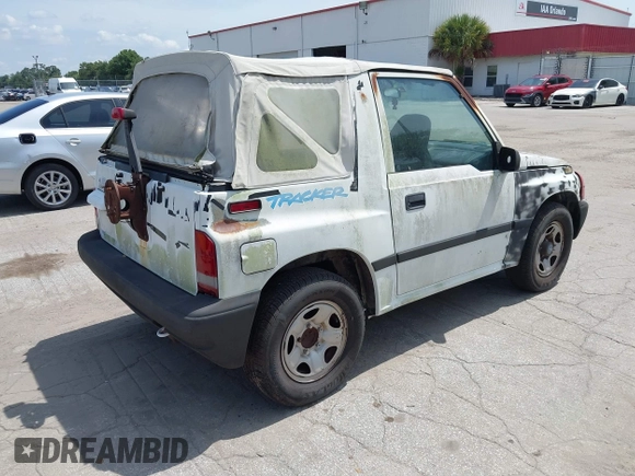 1996 Chevrolet Tracker z VIN 2CNBE1862T6948982, wystawiony jako IAAI lot #42719225 z przebiegiem 257 760 mil mil oraz . Historia ofert i sprzedaży dostępna na DreamBid. Obrazek 4.