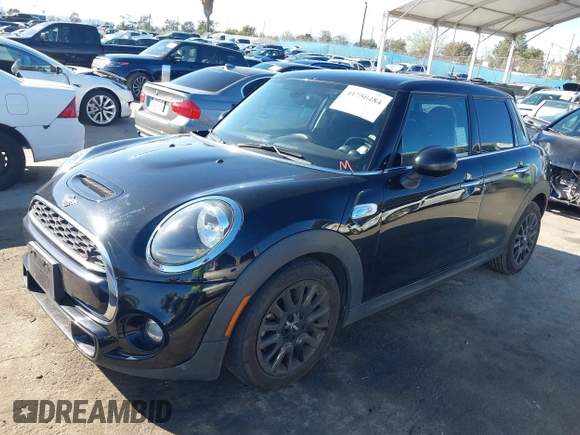 2019 MINI Hardtop 4 Door Cooper S with VIN WMWXU3C58K2H88917, listed as a IAAI auction lot 41750484 with 49,455 mi miles and . Bid and sale history available at DreamBid. Image 2.