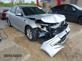 2018 Kia Optima LX z VIN 5XXGT4L3XJG231457, wystawiony jako IAAI lot #42255585 z przebiegiem 75 877 mil mil oraz . Historia ofert i sprzedaży dostępna na DreamBid. Obrazek 1.