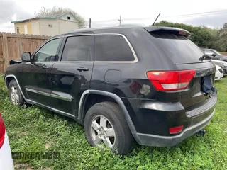 2012 Jeep Grand Cherokee Laredo with VIN 1C4RJEAG8CC119401, listed as a IAAI auction lot 41724335 with 233,265 mi miles. Bid and sale history available at carsss.com. Image 3.