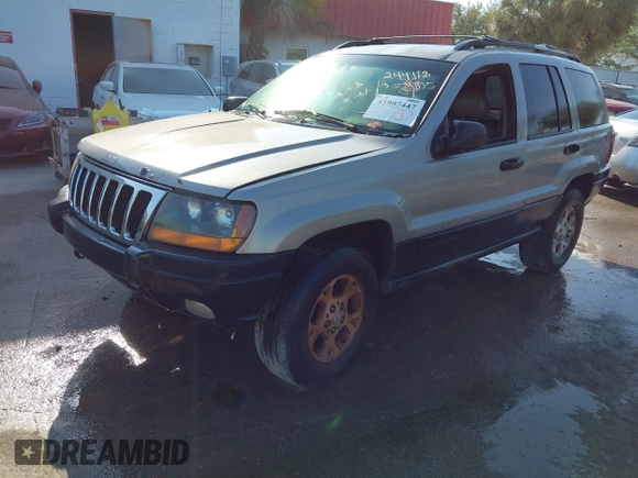 2000 Jeep Grand Cherokee Laredo z VIN 1J4GW48S8YC244168, wystawiony jako IAAI lot #41907447 z przebiegiem 243 154 mil mil oraz . Historia ofert i sprzedaży dostępna na DreamBid. Obrazek 2.