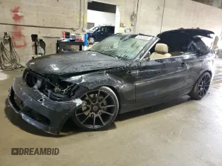 2013 BMW 1 Series 135i with VIN WBAUN7C5XDVM26903, listed as a Copart auction lot 60525595 with 219,810 mi miles and Salvage title. Bid and sale history available at DreamBid. Image 1.