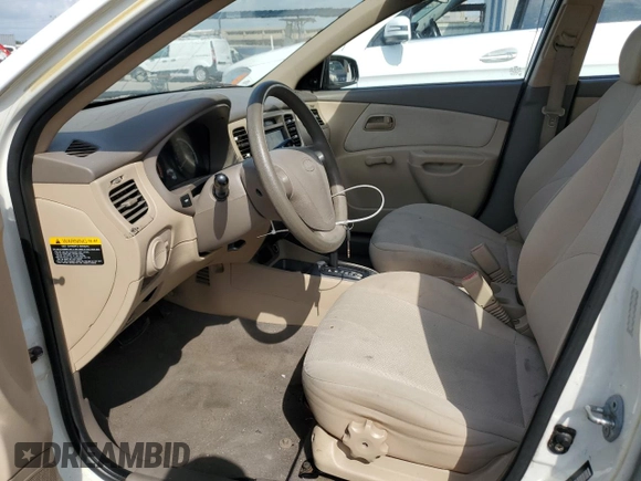 2009 Kia Rio LX with VIN KNADE223X96439445, listed as a Copart auction lot 54619335 with 102,120 mi miles and Salvage Title. Bid and sale history available at DreamBid. Image 7.