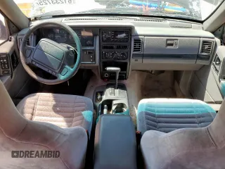 1995 Jeep Grand Cherokee Laredo z VIN 1J4FX58S9SC534442, wystawiony jako Copart lot #61233725 z przebiegiem 363 688 mil mil oraz Szkoda całkowita • Salvage title. Historia ofert i sprzedaży dostępna na DreamBid. Obrazek 8.