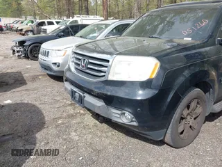 2012 Honda Pilot Touring with VIN 5FNYF4H92CB051260, listed as a IAAI auction lot 41906802 with 256,691 mi miles. Bid and sale history available at carsss.com. Image 6.