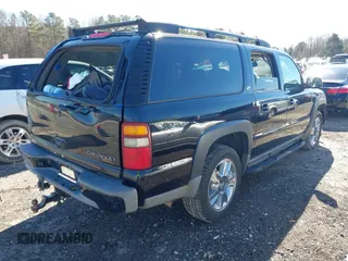 2002 Chevrolet Suburban Z71 with VIN 3GNFK16Z52G264577, listed as a IAAI auction lot 41581984 with 321,321 mi miles. Bid and sale history available at carsss.com. Image 4.