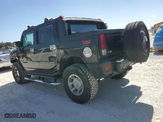 2005 Hummer H2 SUT with VIN 5GRGN22U65H113129, listed as a Copart auction lot 77315854 with 185,197 mi miles and Salvage Title. Bid and sale history available at carsss.com. Image 2.
