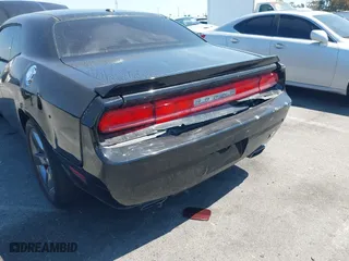 2013 Dodge Challenger SXT with VIN 2C3CDYAG9DH708717, listed as a IAAI auction lot 41990705 with 92,784 mi miles. Bid and sale history available at carsss.com. Image 6.