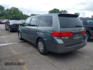 2009 Honda Odyssey LX with VIN 5FNRL38269B043326, listed as a IAAI auction lot 42872714 with 235,087 mi miles and . Bid and sale history available at DreamBid. Image 3.