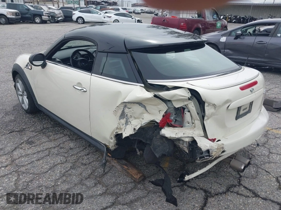 2013 MINI Coupe S with VIN WMWSX3C53DT466648, listed as a IAAI auction lot 41719597 with 106,936 mi miles and . Bid and sale history available at DreamBid. Image 3.
