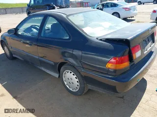 1997 Honda Civic DX with VIN 1HGEJ6120VL048384, listed as a IAAI auction lot 41866628 with 286,599 mi miles. Bid and sale history available at carsss.com. Image 3.