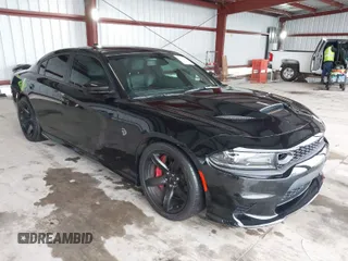 2019 Dodge Charger SRT Hellcat with VIN 2C3CDXL97KH552439, listed as a IAAI auction lot 41813879 with 58,921 mi miles and . Bid and sale history available at carsss.com. Image 1.