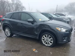 2014 Mazda CX-5 Grand Touring with VIN JM3KE4DY0E0392476, listed as a IAAI auction lot 41419144 with 89,245 mi miles and . Bid and sale history available at carsss.com. Image 13.