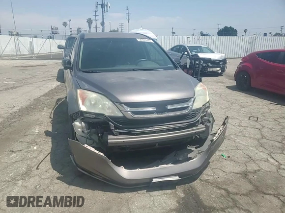 2010 Honda CR-V LX z VIN 5J6RE3H38AL034061, wystawiony jako Copart lot #54978905 z przebiegiem 154 951 mil mil oraz Szkoda całkowita • Salvage title. Historia ofert i sprzedaży dostępna na DreamBid. Obrazek 13.