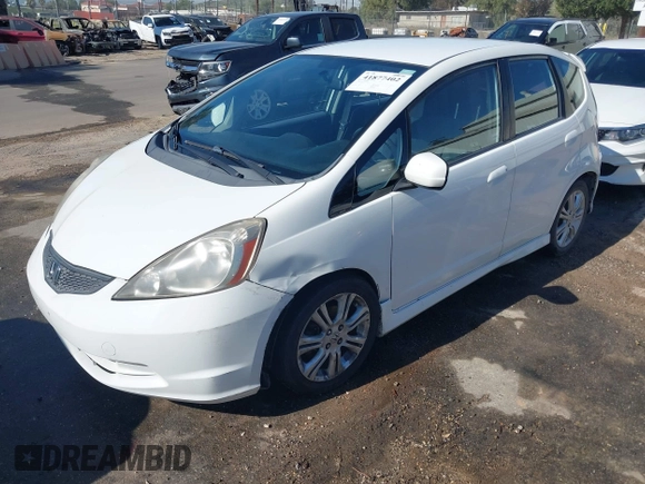 2009 Honda Fit Sport w/Navi with VIN JHMGE88679S067041, listed as a IAAI auction lot 41877402 with 162,485 mi miles. Bid and sale history available at carsss.com. Image 2.