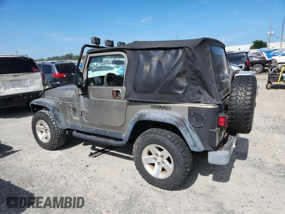 2003 Jeep Wrangler Rubicon with VIN 1J4FA69S13P310131, listed as a Copart auction lot 59139025 with 260,349 mi miles and Salvage title. Bid and sale history available at DreamBid. Image 2.