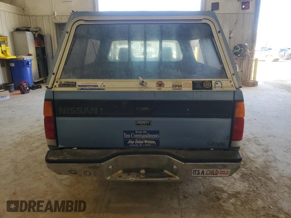 1989 Nissan Hardbody z VIN 1N6HD16S3KC401756, wystawiony jako Copart lot #46811635 z przebiegiem 78 698 mil mil oraz Szkoda całkowita • Salvage title. Historia ofert i sprzedaży dostępna na DreamBid. Obrazek 6.