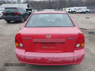 2005 Hyundai Accent GLS with VIN KMHCG45CX5U614083, listed as a IAAI auction lot 41006582 with 72,516 mi miles. Bid and sale history available at carsss.com. Image 16.