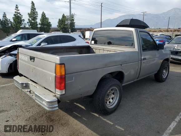 1987 Nissan Hardbody E z VIN JN6ND11SXHW014073, wystawiony jako Copart lot #78956934 z przebiegiem 381 885 mil mil oraz Szkody całkowita. Historia ofert i sprzedaży dostępna na DreamBid. Obrazek 3.