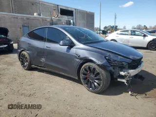 2023 Tesla Model Y Performance with VIN 7SAYGDEF3PF946496, listed as a Copart auction lot 50800315 with 15,077 mi miles and Salvage Title. Bid and sale history available at DreamBid. Image 4.