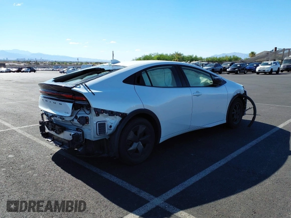 2023 Toyota Prius LE with VIN JTDACAAU7P3013923, listed as a IAAI auction lot 42600973 with 33,958 mi miles and . Bid and sale history available at DreamBid. Image 4.