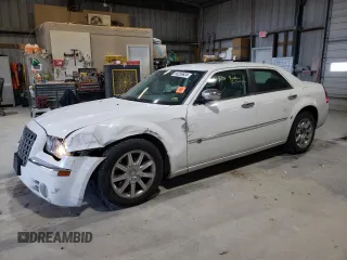 2010 Chrysler 300 with VIN 2C3CA6CT8AH329985, listed as a Copart auction lot 84556624 with 165,348 mi miles and Salvage Title. Bid and sale history available at carsss.com. Image 1.