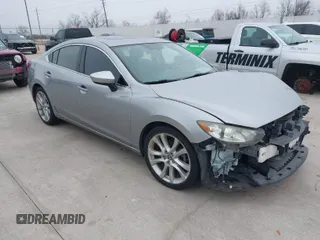 2015 Mazda 6 i Touring with VIN JM1GJ1V56F1209476, listed as a IAAI auction lot 41644215 with 112,255 mi miles. Bid and sale history available at carsss.com. Image 1.