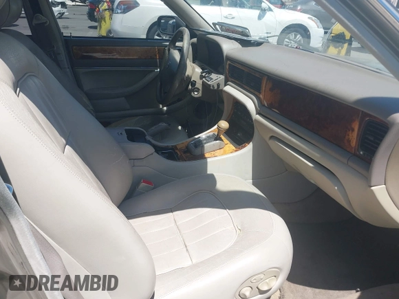1997 Jaguar XJ with VIN SAJHX1243VC811674, listed as a IAAI auction lot 42333801 with 213,248 mi miles and . Bid and sale history available at DreamBid. Image 5.