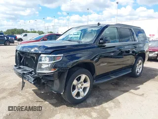 2015 Chevrolet Tahoe LT with VIN 1GNSCBKCXFR214072, listed as a IAAI auction lot 40512435 with 98,955 mi miles and . Bid and sale history available at DreamBid. Image 19.