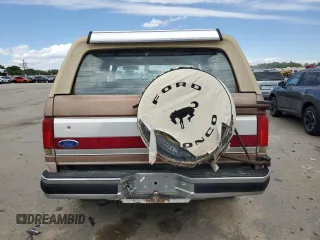 1989 Ford Bronco XL z VIN 1FMEU15N6KLA87551, wystawiony jako Copart lot #56662825 z przebiegiem 87 257 mil mil oraz Czysty tytuł • Clean title. Historia ofert i sprzedaży dostępna na DreamBid. Obrazek 6.