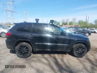 2018 Jeep Grand Cherokee Laredo E with VIN 1C4RJFAG2JC320441, listed as a IAAI auction lot 42095419 with 136,962 mi miles. Bid and sale history available at carsss.com. Image 13.
