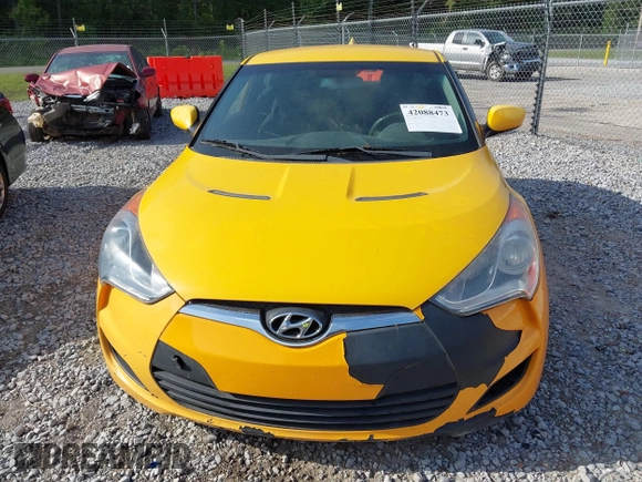 2012 Hyundai Veloster w/Gray Int z VIN KMHTC6AD2CU079902, wystawiony jako IAAI lot #42088473 z przebiegiem 143 983 mil mil oraz . Historia ofert i sprzedaży dostępna na DreamBid. Obrazek 6.