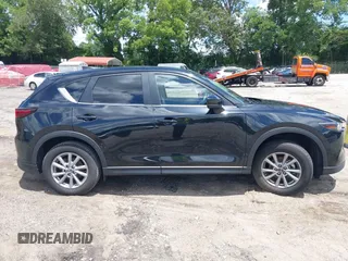 2023 Mazda CX-5 S Carbon Edition z VIN JM3KFBCMXP0201665, wystawiony jako IAAI lot #39965378 z przebiegiem 29 105 mil mil oraz . Historia ofert i sprzedaży dostępna na DreamBid. Obrazek 13.