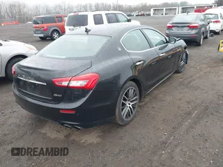 2017 Maserati Ghibli with VIN ZAM57XSA3H1197716, listed as a IAAI auction lot 41918916 with 47,779 mi miles. Bid and sale history available at carsss.com. Image 4.