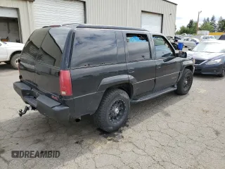 1999 GMC Denali z VIN 1GKEK13R1XR917376, wystawiony jako Copart lot #64991924 z przebiegiem 247 231 mil mil oraz Tytuł czysty. Historia ofert i sprzedaży dostępna na DreamBid. Obrazek 3.
