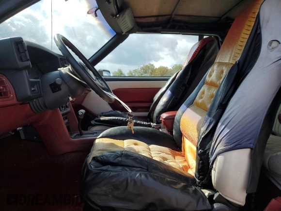 1989 Ford Mustang with VIN 1FABP44A5KF214843, listed as a Copart auction lot 74890984 with 65,601 mi miles and Clean title. Bid and sale history available at DreamBid. Image 7.