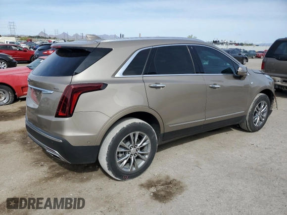 2022 Cadillac XT5 FWD Premium Luxury z VIN 1GYKNCRS9NZ180043, wystawiony jako Copart lot #51352195 z przebiegiem 12 399 mil mil oraz Szkoda całkowita • Salvage title. Historia ofert i sprzedaży dostępna na DreamBid. Obrazek 3.