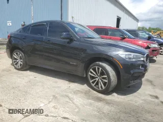 2015 BMW X6 xDrive35i z VIN 5UXKU2C58F0N77513, wystawiony jako Copart lot #55859345 z przebiegiem 82 560 mil mil oraz Szkoda całkowita • Salvage title. Historia ofert i sprzedaży dostępna na DreamBid. Obrazek 4.