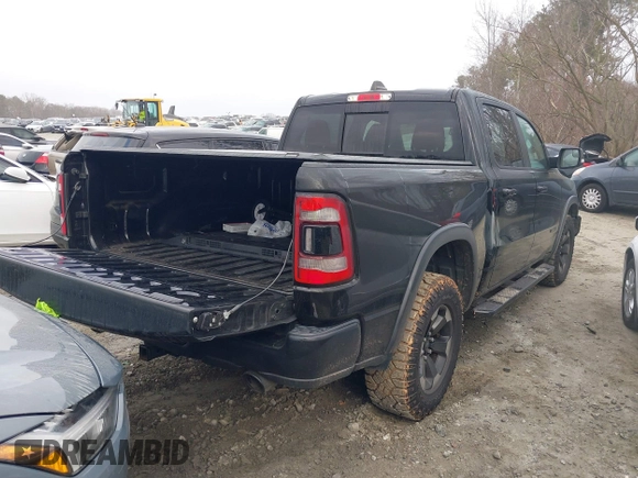 2019 Ram 1500 Rebel with VIN 1C6SRFLTXKN580782, listed as a IAAI auction lot 41498027 with 83,669 mi miles and . Bid and sale history available at DreamBid. Image 4.