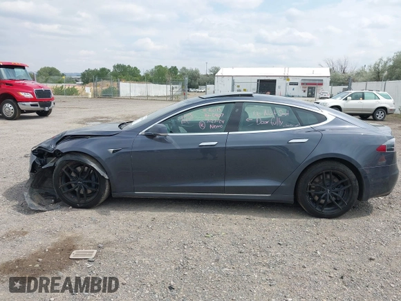 2019 Tesla Model S 75D with VIN 5YJSA1E22KF300407, listed as a IAAI auction lot 40034839 with 59,178 mi miles and . Bid and sale history available at DreamBid. Image 13.
