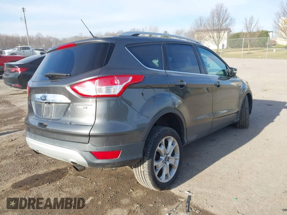 2015 Ford Escape Titanium with VIN 1FMCU9J90FUB58306, listed as a IAAI auction lot 41815151 with 136,835 mi miles. Bid and sale history available at carsss.com. Image 4.