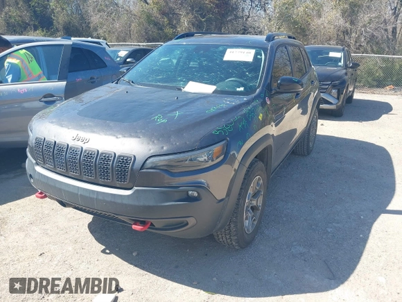 2022 Jeep Cherokee Trailhawk with VIN 1C4PJMBX4ND535037, listed as a IAAI auction lot 41779140 with 49,733 mi miles. Bid and sale history available at carsss.com. Image 2.