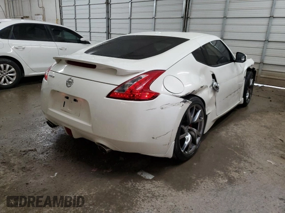 2013 Nissan 370Z Touring z VIN JN1AZ4EH5DM383466, wystawiony jako Copart lot #85704054 z przebiegiem 37 892 mil mil oraz Szkoda całkowita • Salvage title. Historia ofert i sprzedaży dostępna na DreamBid. Obrazek 3.