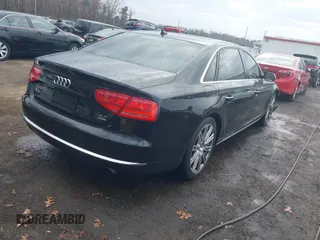 2012 Audi A8 L with VIN WAURVAFD8CN006917, listed as a IAAI auction lot 40877090 with 144,387 mi miles. Bid and sale history available at carsss.com. Image 4.