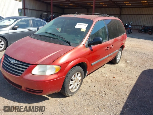 2006 Chrysler Town & Country SWB with VIN 1A4GP45R76B572053, listed as a IAAI auction lot 42015562 with 310,509 mi miles. Bid and sale history available at carsss.com. Image 2.