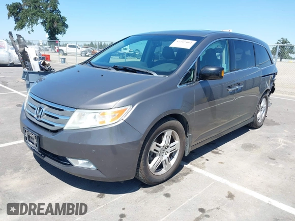 2012 Honda Odyssey Touring with VIN 5FNRL5H98CB011297, listed as a IAAI auction lot 42207061 with 154,073 mi miles and . Bid and sale history available at DreamBid. Image 17.