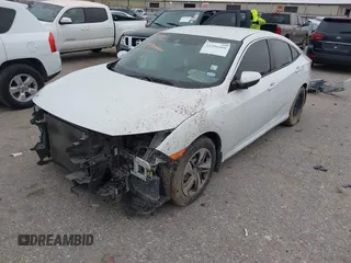 2020 Honda Civic LX with VIN 19XFC2F62LE021811, listed as a IAAI auction lot 41591466 with 75,797 mi miles and . Bid and sale history available at DreamBid. Image 18.